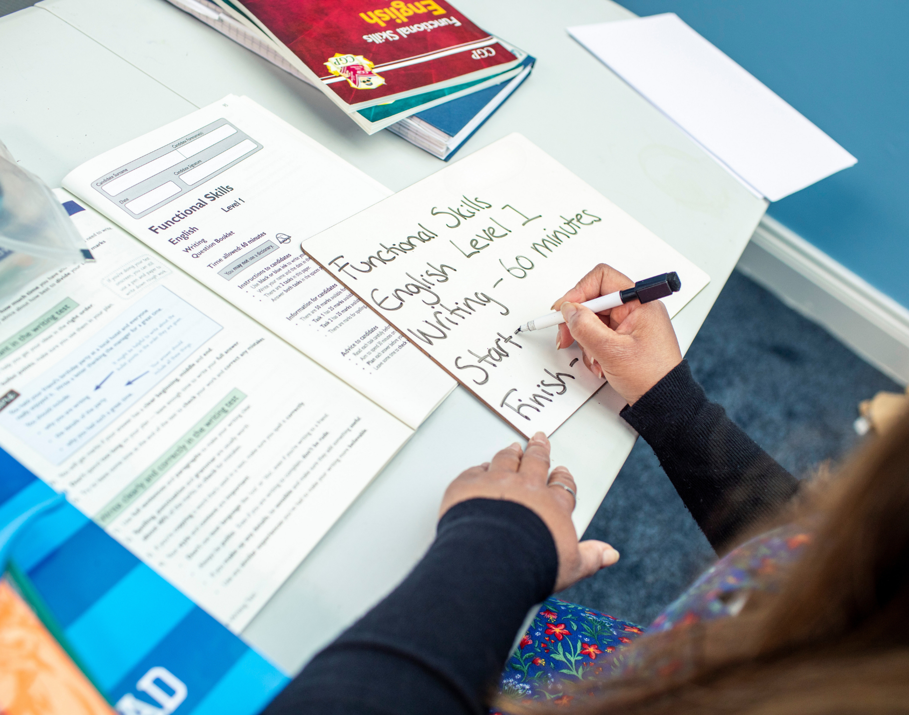 Image of tutor writing