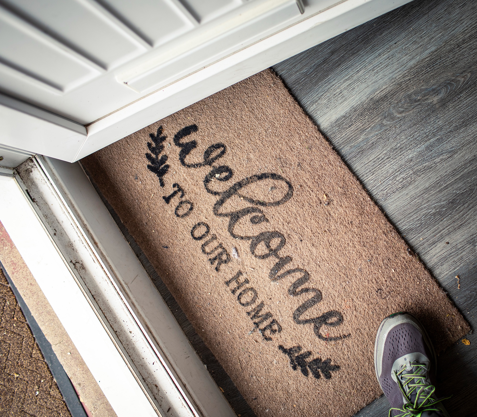 Image of doormat with welcome message